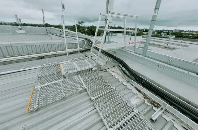 Roof walkway and fall arrest anchor system installed by Alpine-Tech 360 on a commercial building