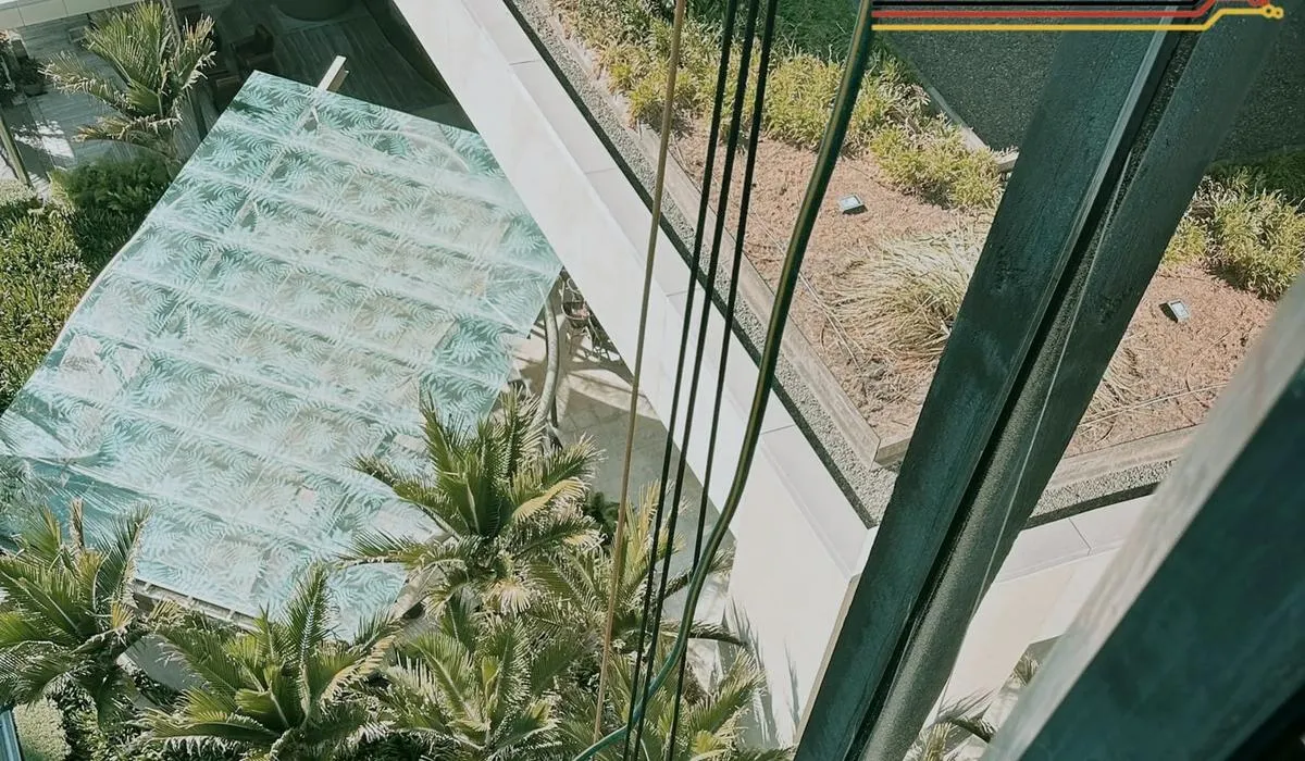 Alpine-Tech 360 rope access technician carrying out a water leak test on a glazed atrium roof in Auckland